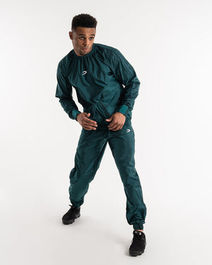 Man in a green sauna suit tracksuit with a white boxraw logo on the chest as well as adjustable wrist straps and made from polyester.